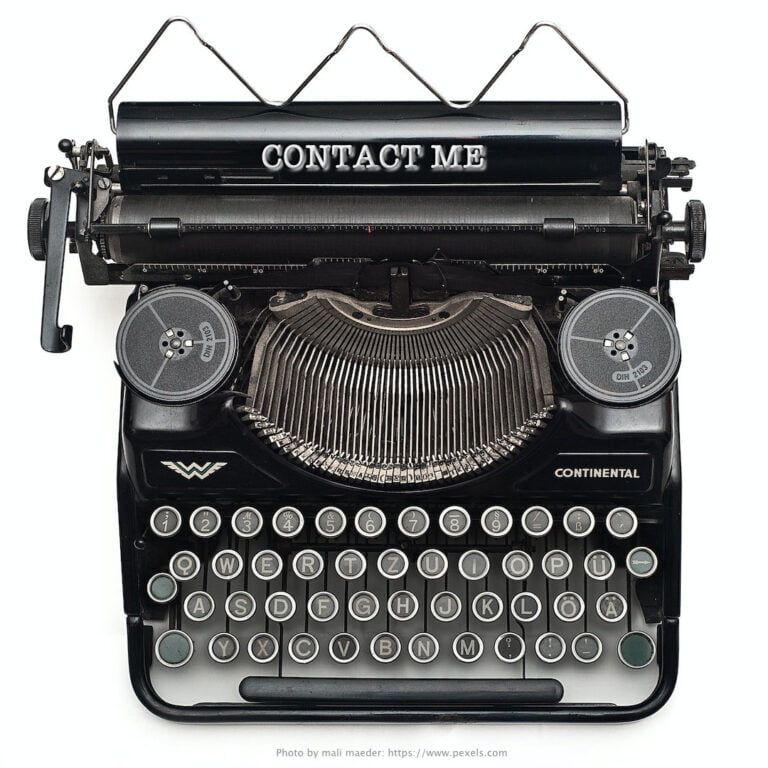 OLD TYPEWRITER WITH CONTACT ME MESSAGE